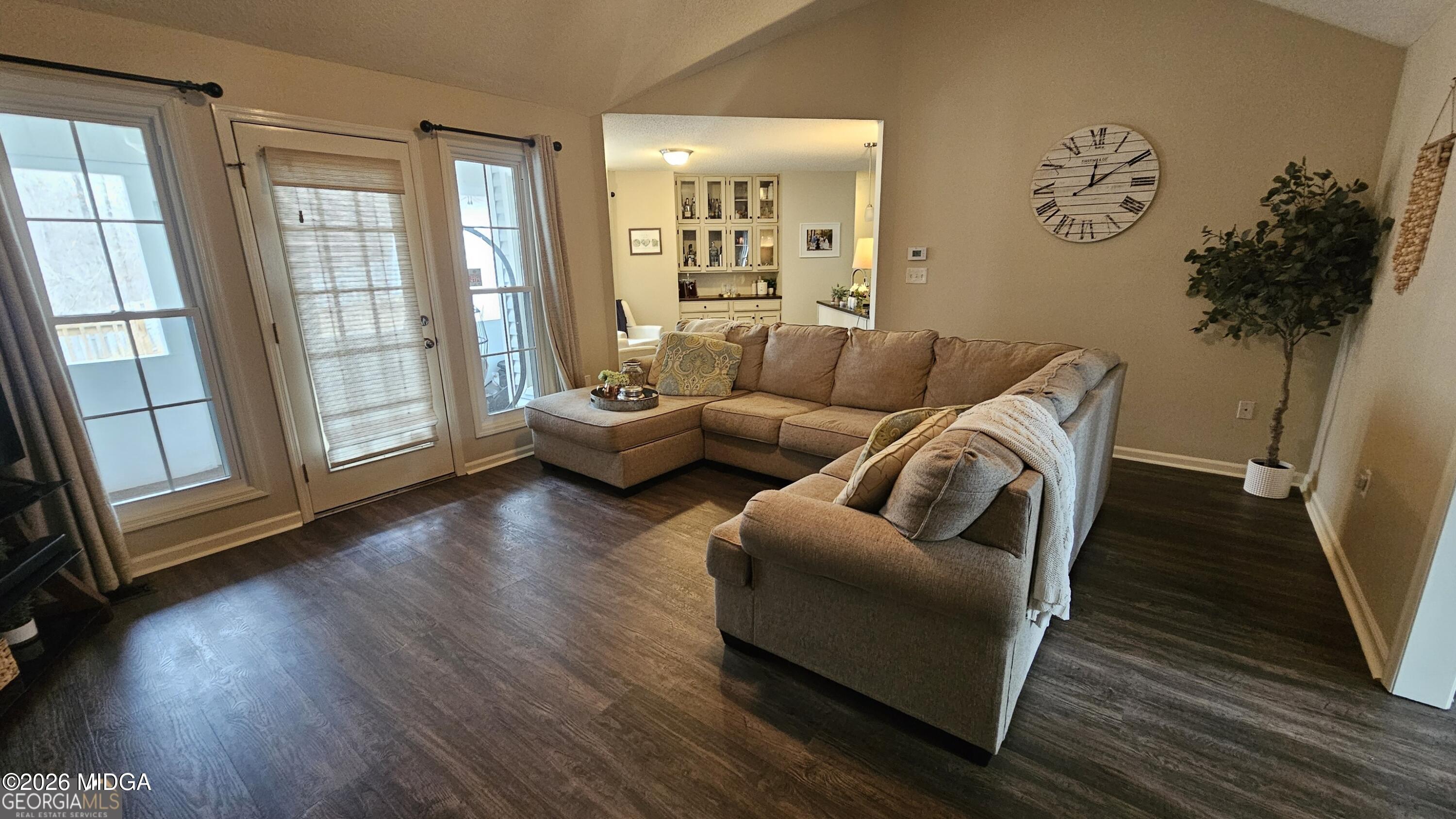 306 Lakeridge Court Macon, GA 31211 - Photo 5 of 14 a living room with furniture and a large window with wooden floor