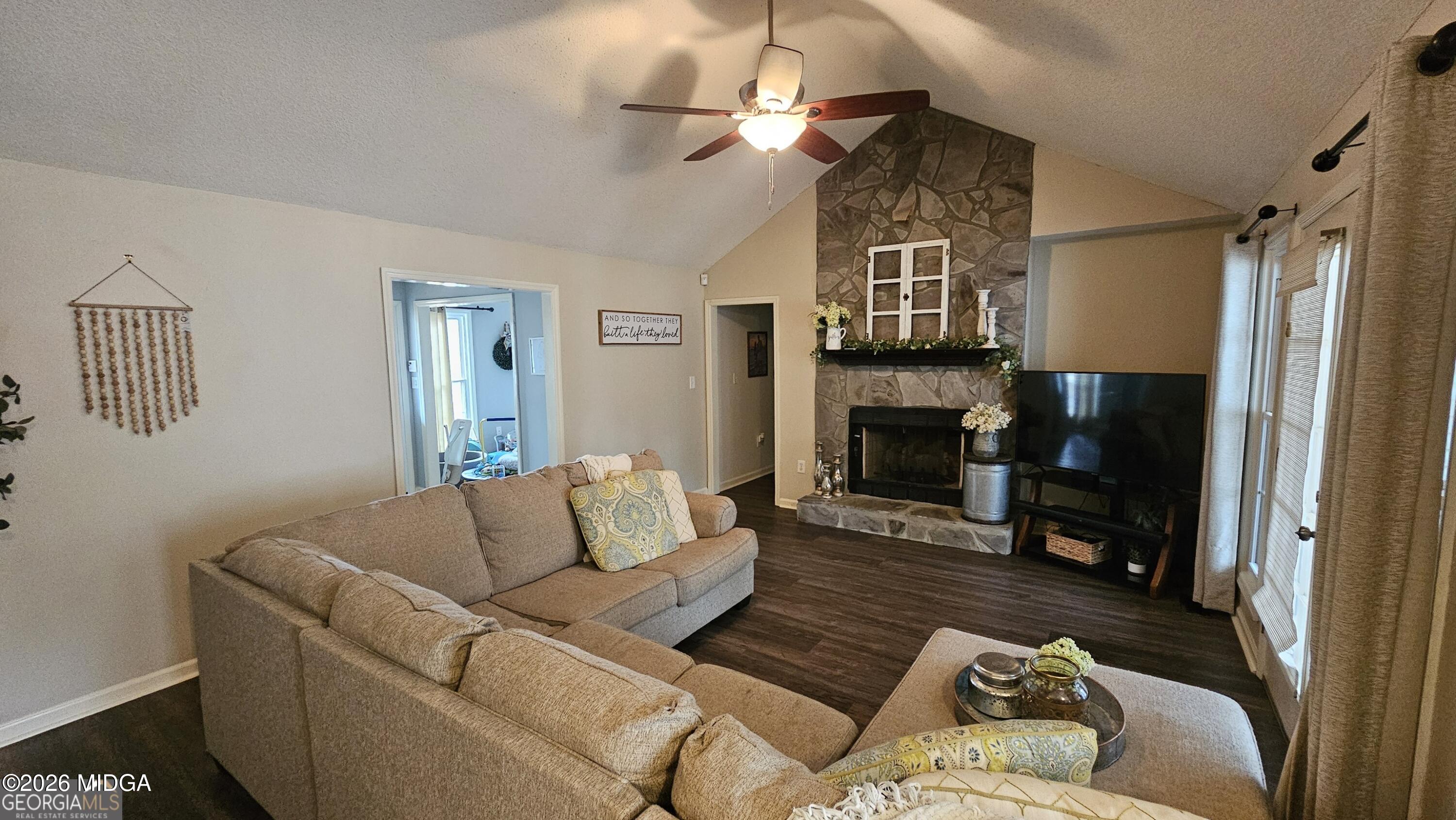 306 Lakeridge Court Macon, GA 31211 - Photo 6 of 14 a living room with furniture fireplace and a window