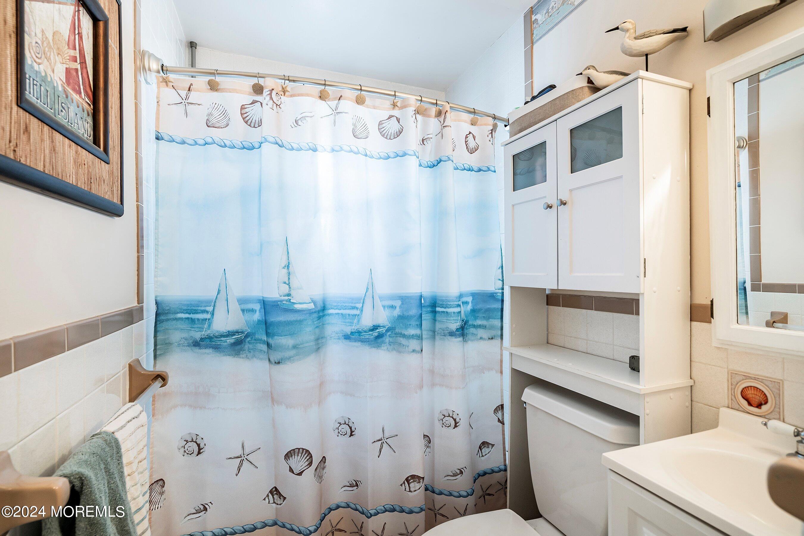 31 Cedar Run Road Bayville, NJ 08721 - Photo 19 of 34 a bathroom with a bathtub and shower