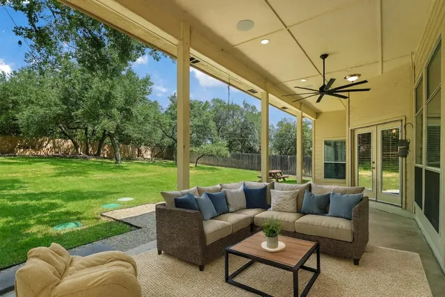 a living room with furniture and a garden