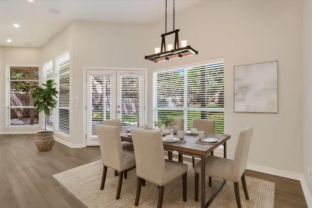 a view of a dining room with furniture window and outside view