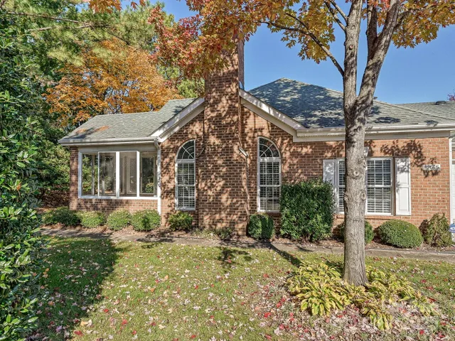 a view of a lake with a house in the background