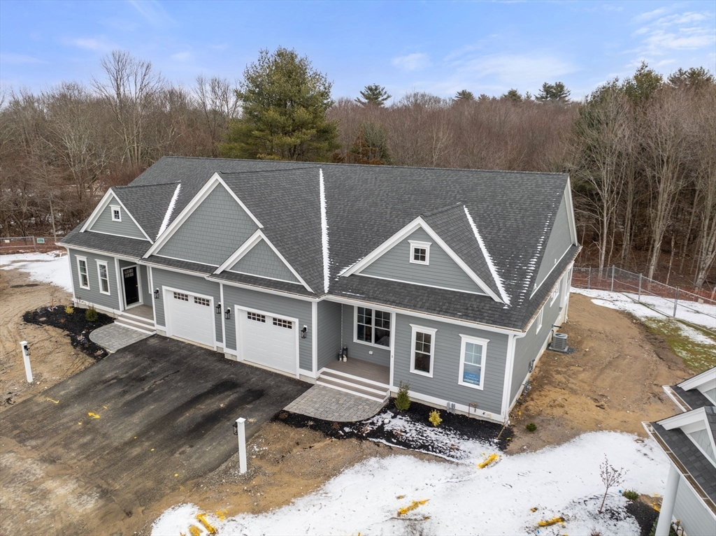 5 Damon Road, Unit 13 Medfield, MA 02052 - Photo 1 of 29 a front view of a house with a yard