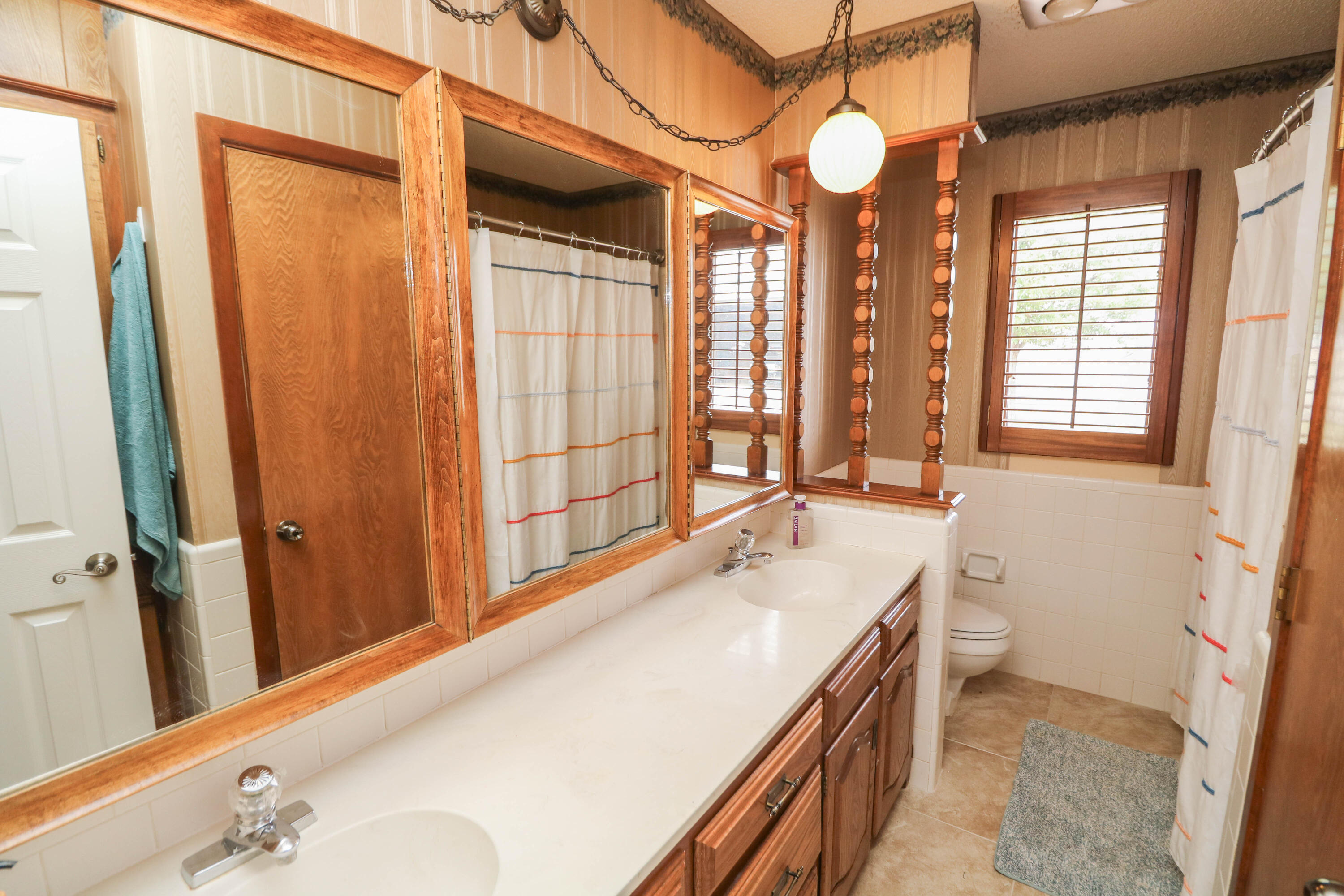 1740 Highway 70 Springlake, TX 79082 - Photo 13 of 39 a bathroom with a double vanity sink a toilet and a tub