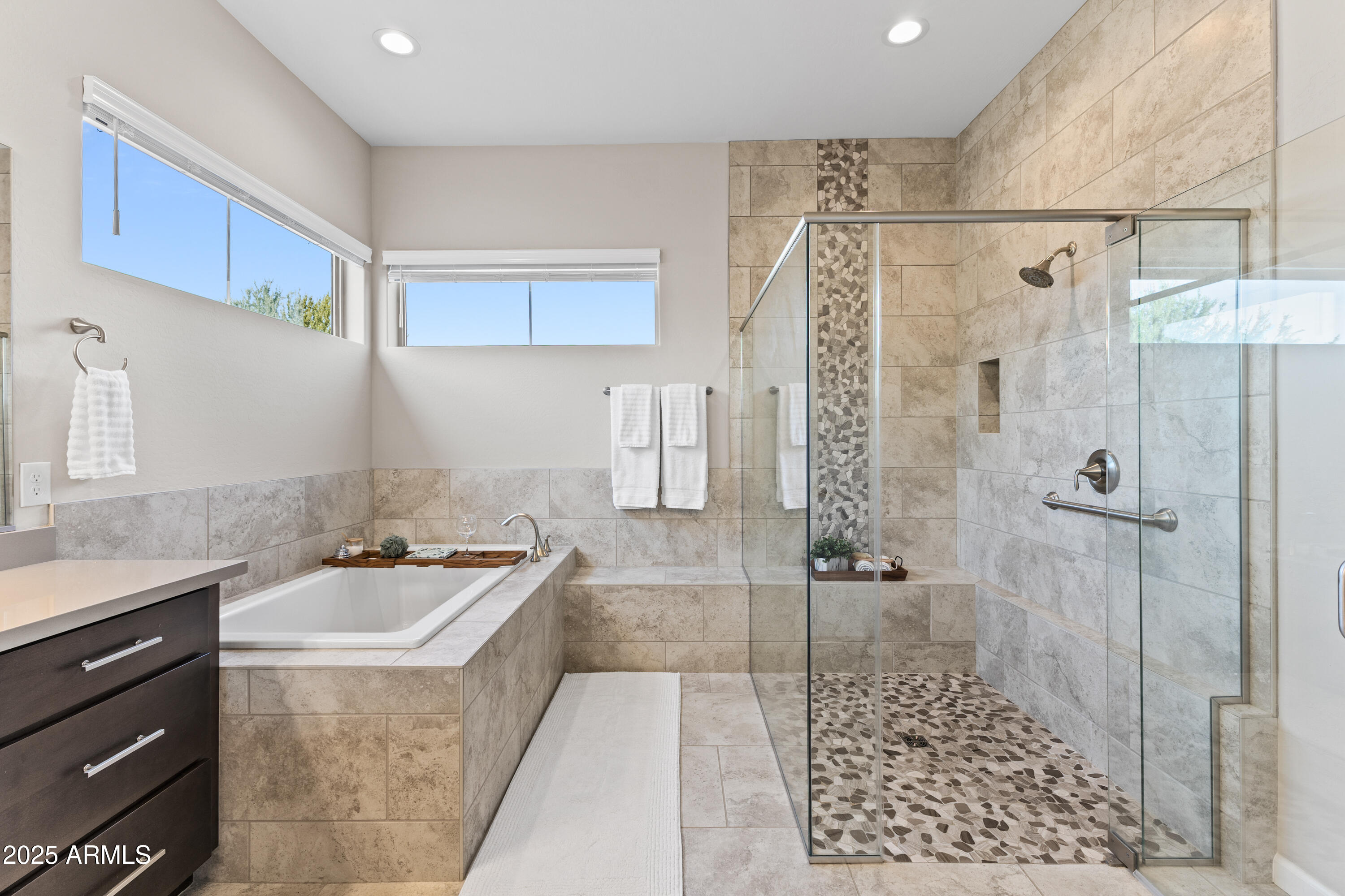 17621 Blaze Lane Rio Verde, AZ 85263 - Photo 16 of 57 a bathroom with a sink a toilet a mirror and shower