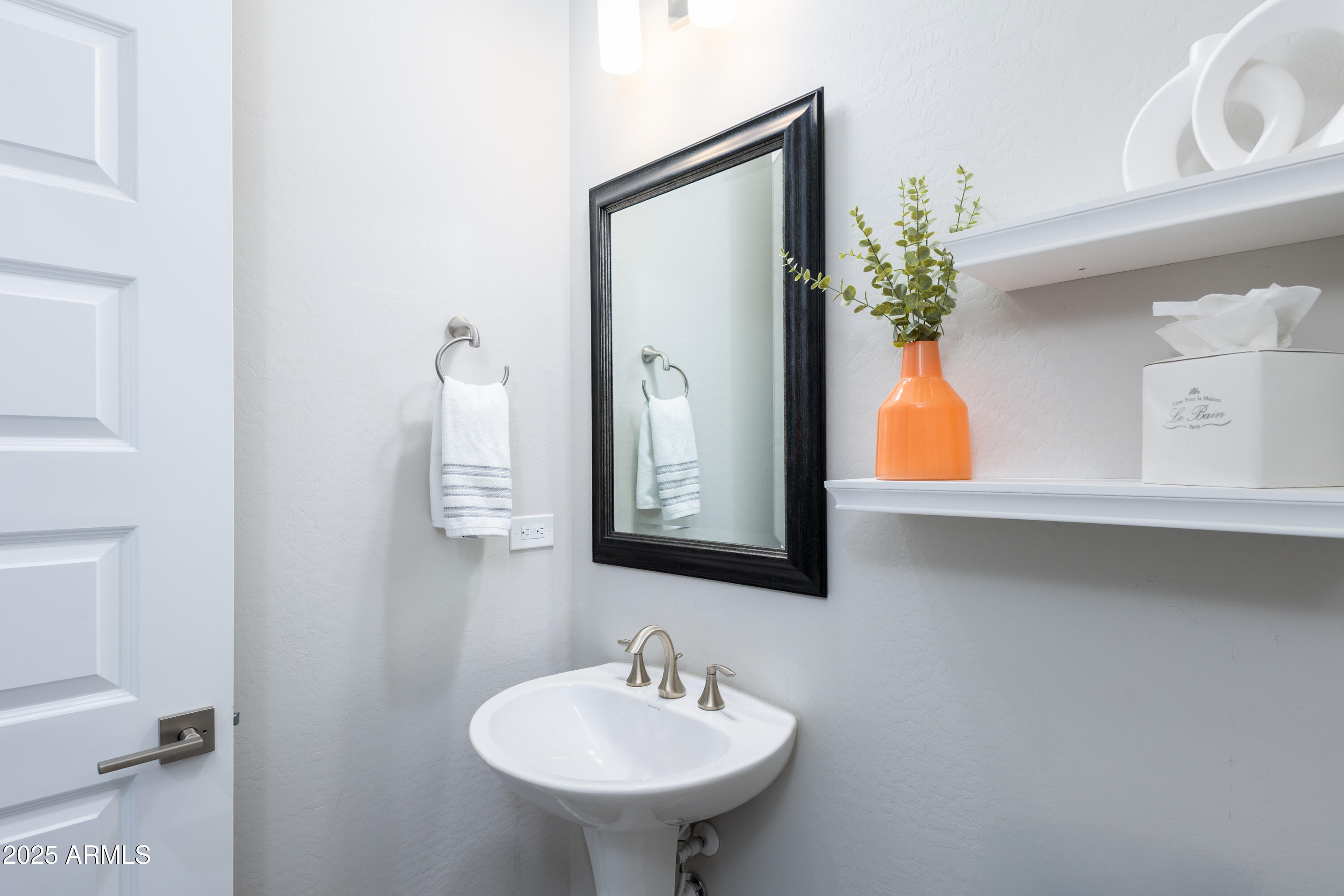 17621 Blaze Lane Rio Verde, AZ 85263 - Photo 27 of 57 a bathroom with a sink and a mirror