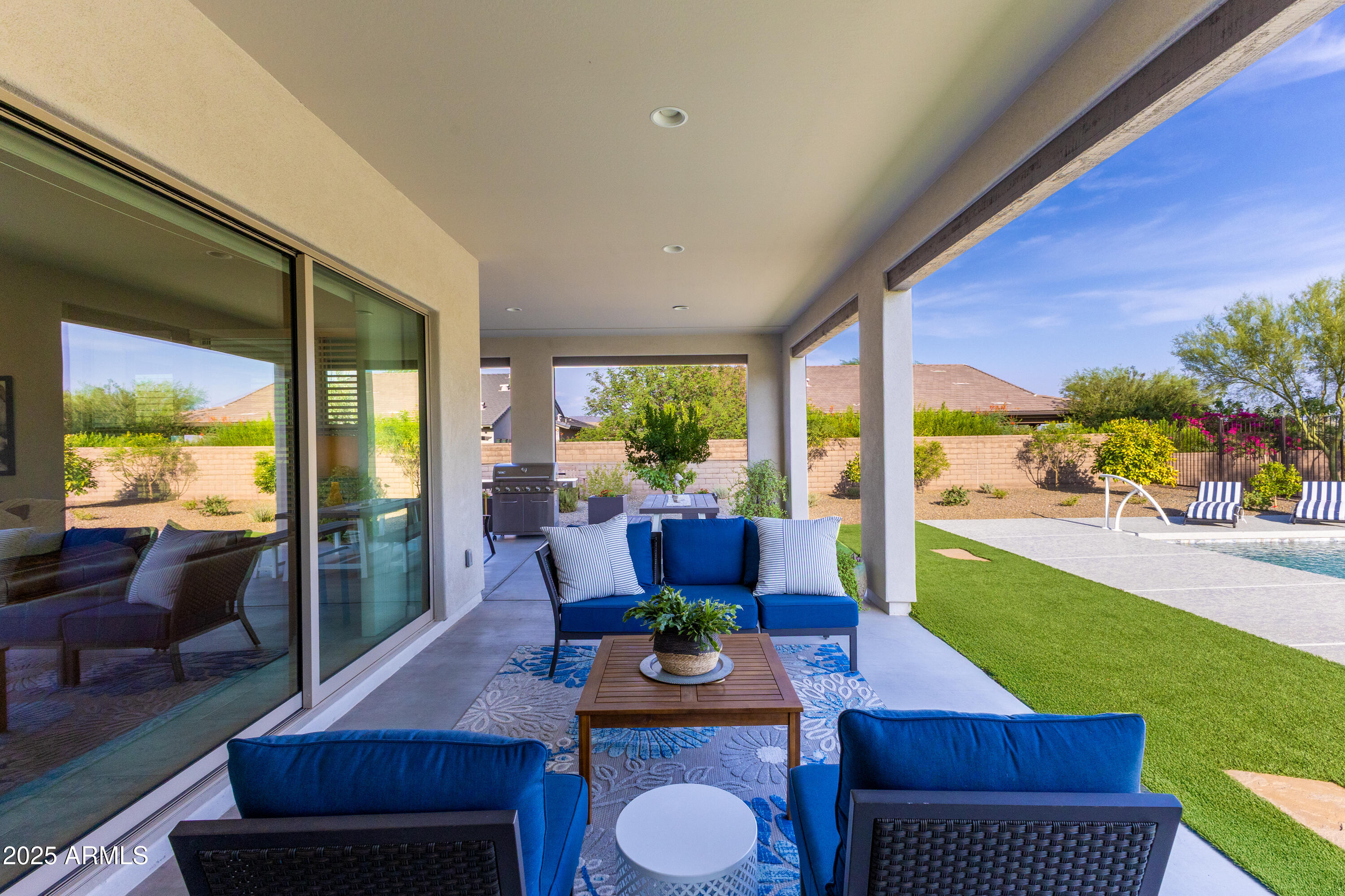 17621 Blaze Lane Rio Verde, AZ 85263 - Photo 29 of 57 a living room with furniture and a large window