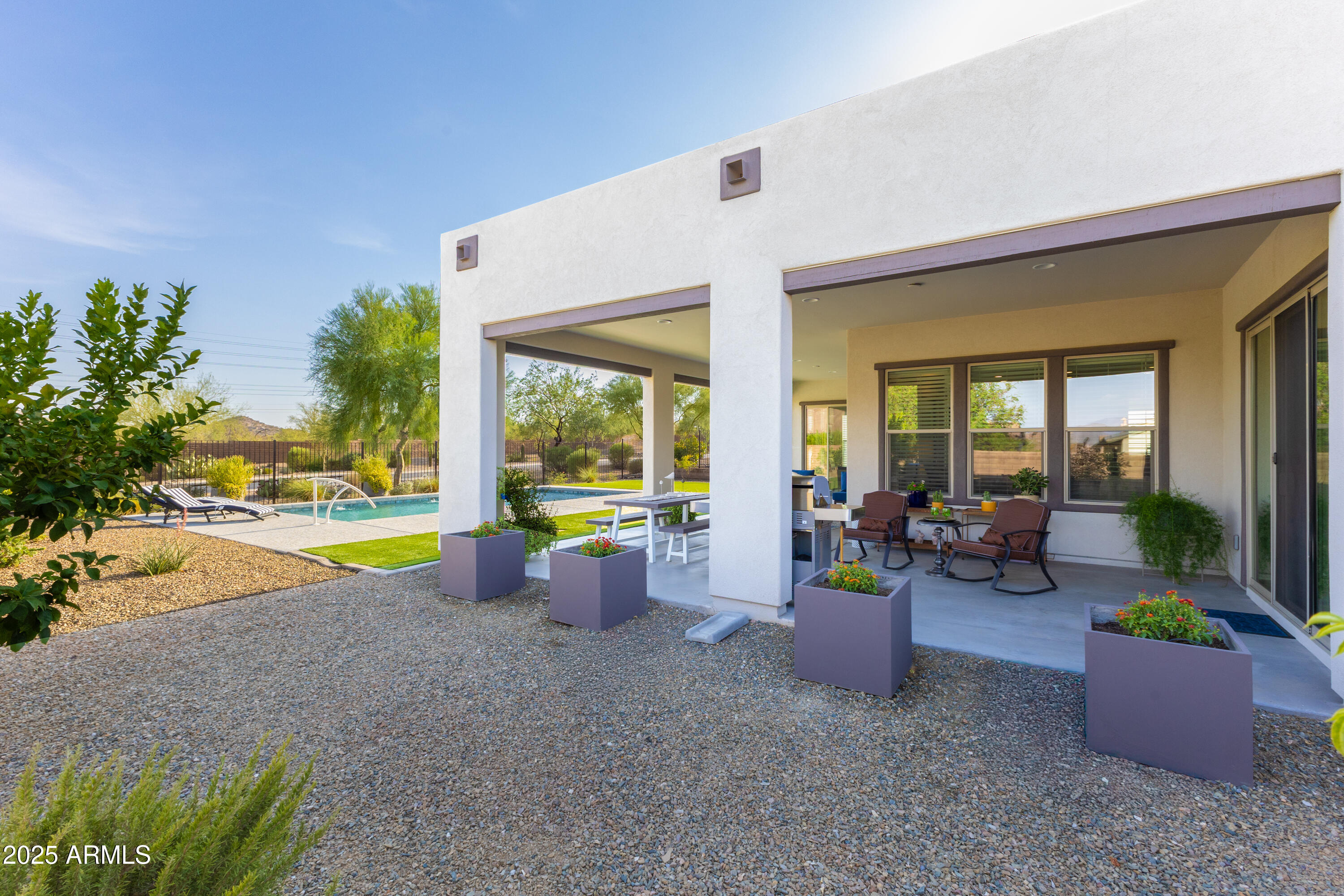 17621 Blaze Lane Rio Verde, AZ 85263 - Photo 30 of 57 a view of a house with swimming pool and porch