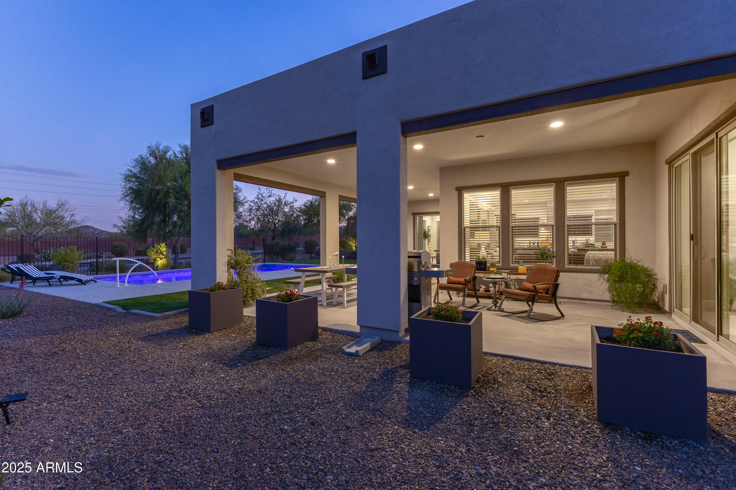 17621 Blaze Lane Rio Verde, AZ 85263 - Photo 34 of 57 a living room with furniture and a floor to ceiling window