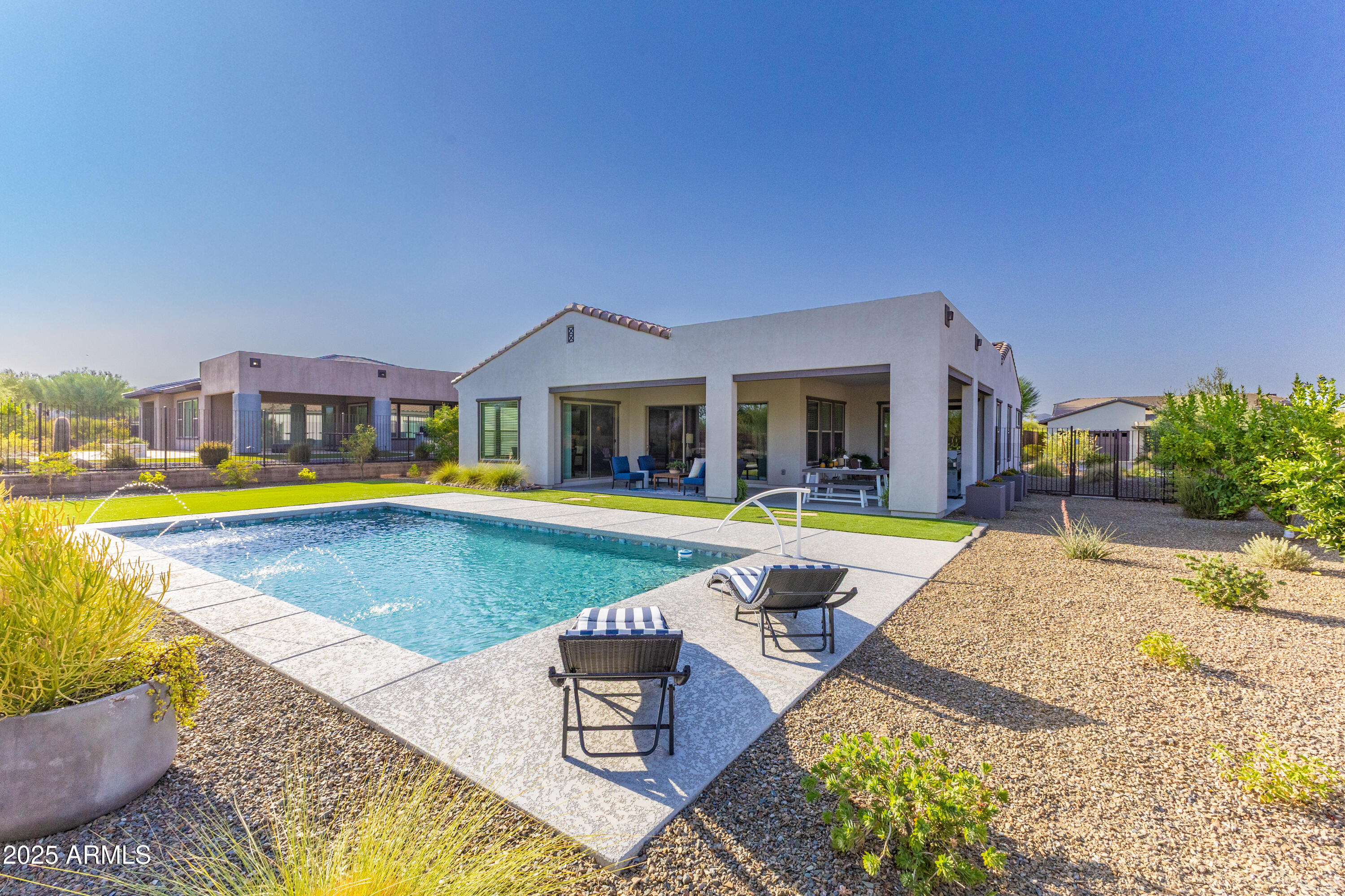 17621 Blaze Lane Rio Verde, AZ 85263 - Photo 37 of 57 a view of house with swimming pool and outdoor seating