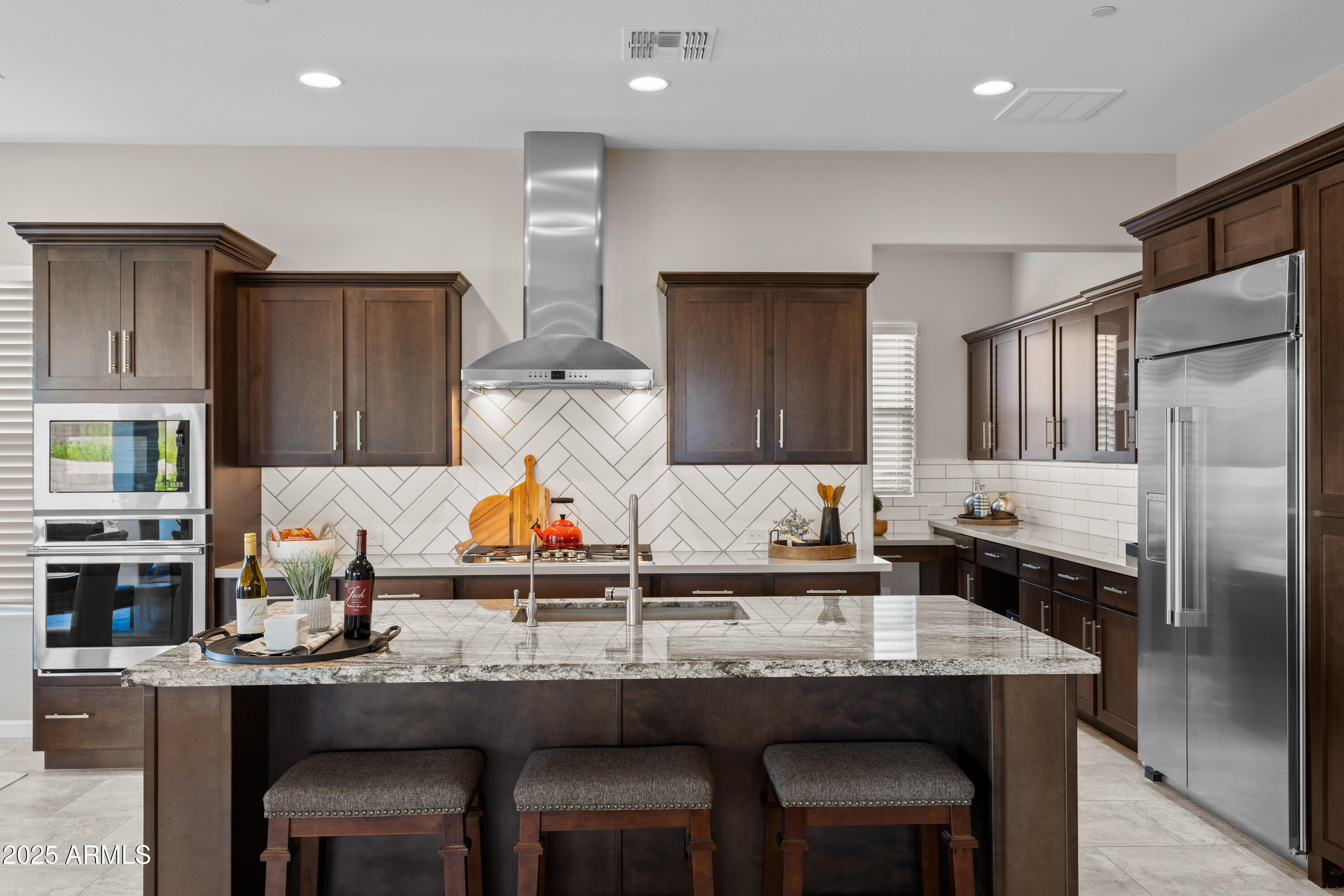17621 Blaze Lane Rio Verde, AZ 85263 - Photo 10 of 57 a kitchen with a table and chairs in it