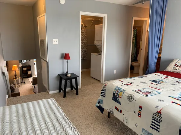 a bedroom with a bed and a dresser