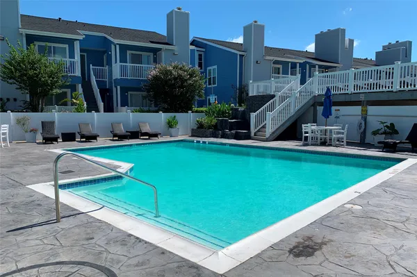 a view of a house with swimming pool