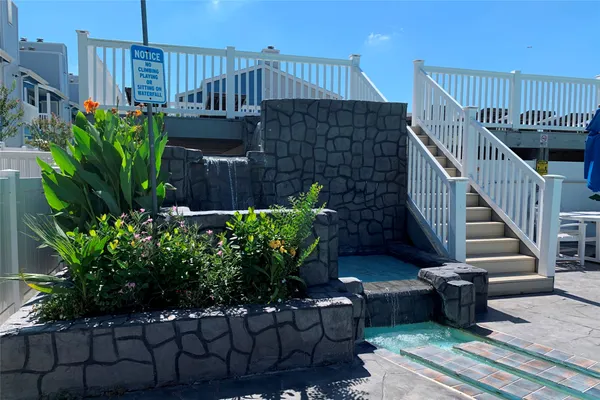 a view of a house with wooden stairs front