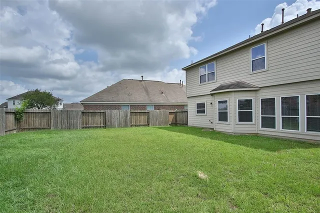 a view of a yard in front of a house