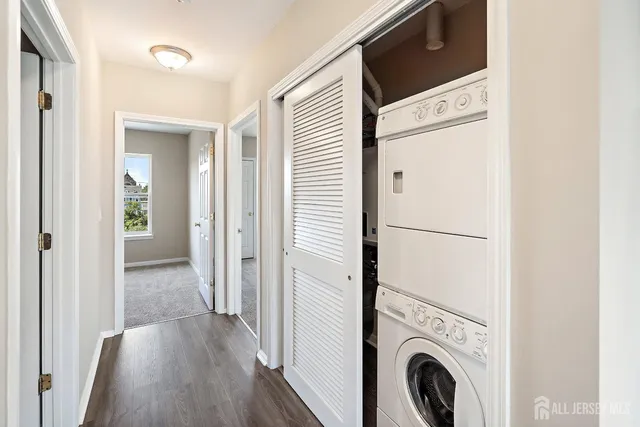a view of a hallway with washer and dryer