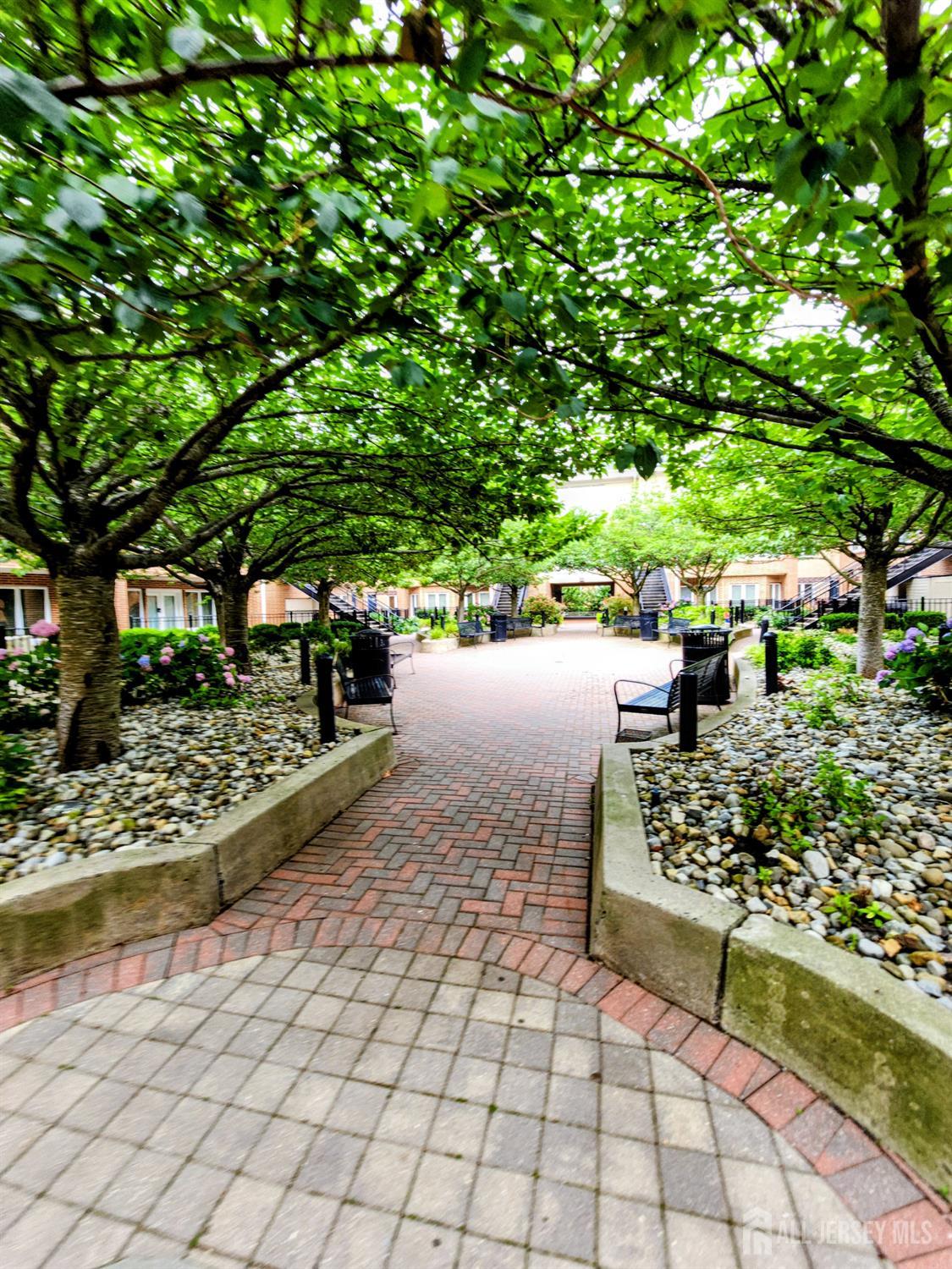 368 Rector Street, Unit 521 Perth Amboy, NJ 08861 - Photo 23 of 41 a view of a pathway with a bench