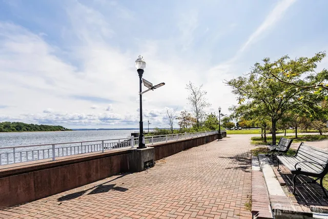 a view of a lake with outdoor seating and a lake view