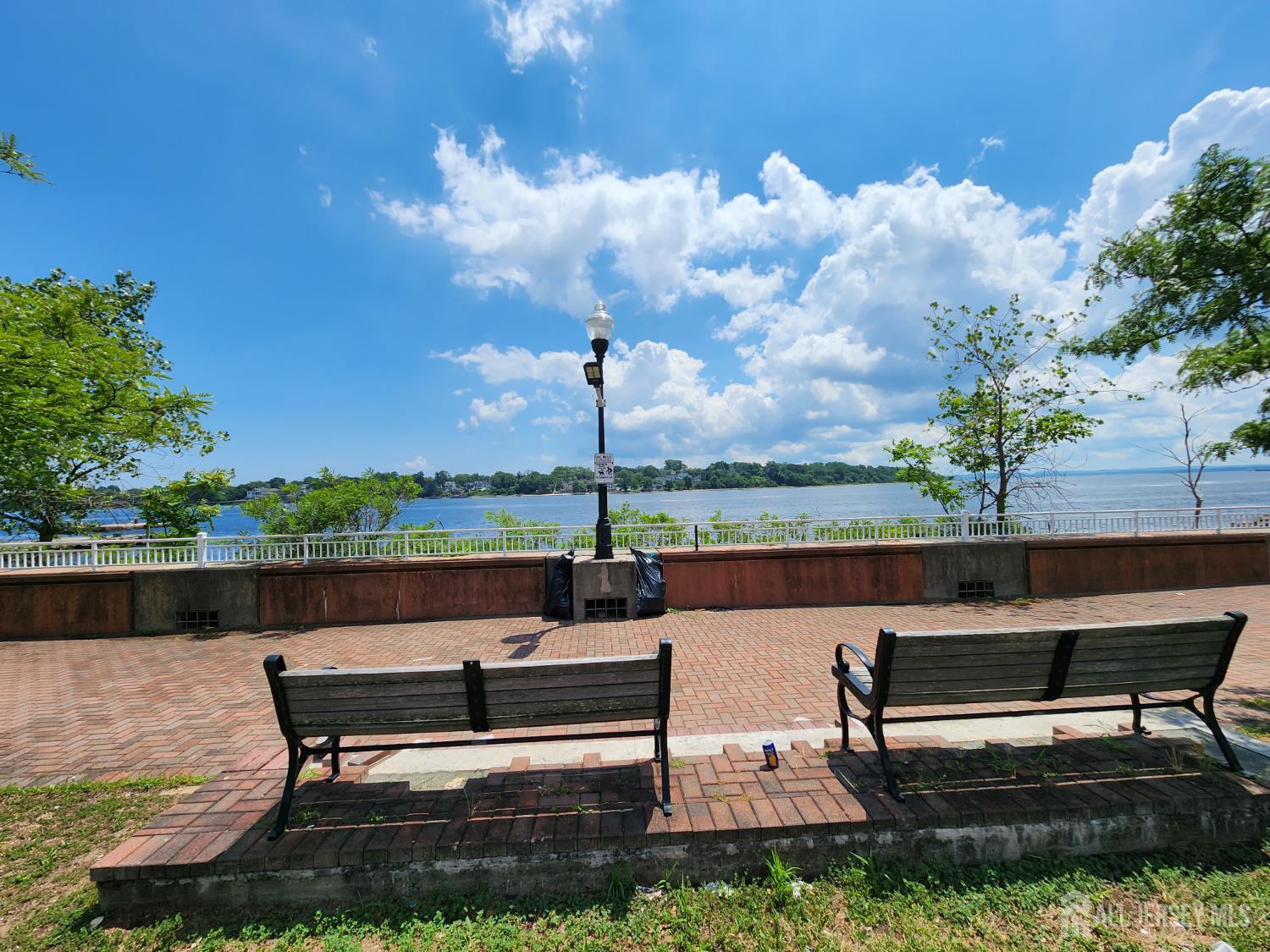 368 Rector Street, Unit 521 Perth Amboy, NJ 08861 - Photo 31 of 41 a view of a lake with outdoor seating and a lake view