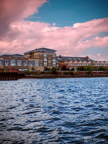 a view of a lake with outdoor seating