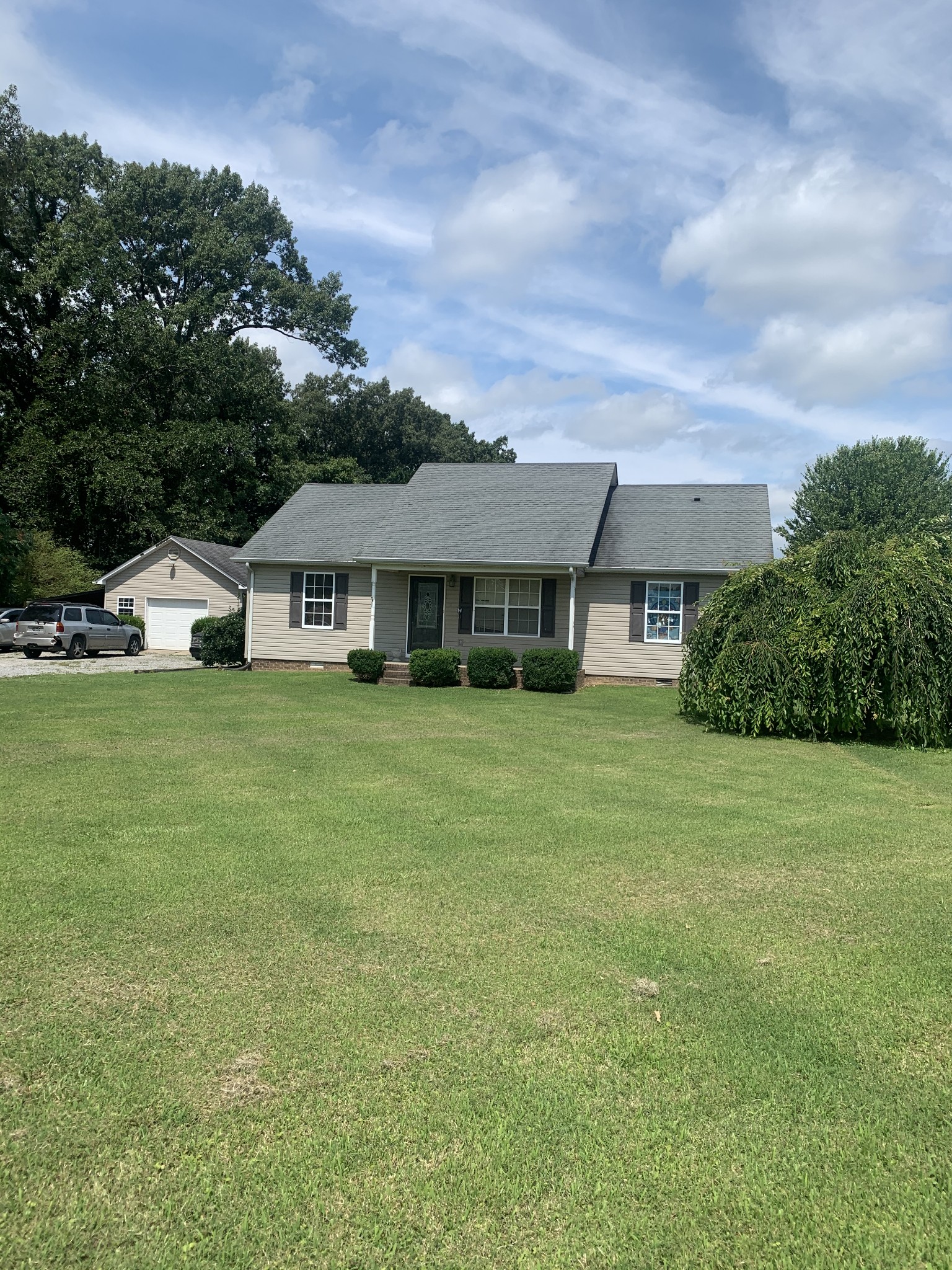 11 Myrick Road Flintville, TN 37335 - Photo 1 of 19 a front view of a house with garden