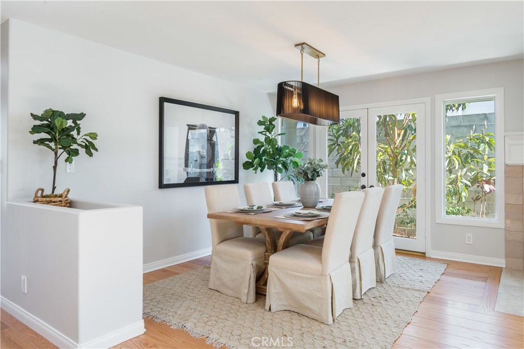 1545 5th Street Manhattan Beach, CA 90266 - Photo 3 of 3 a dining room with furniture potted plants and wooden floor