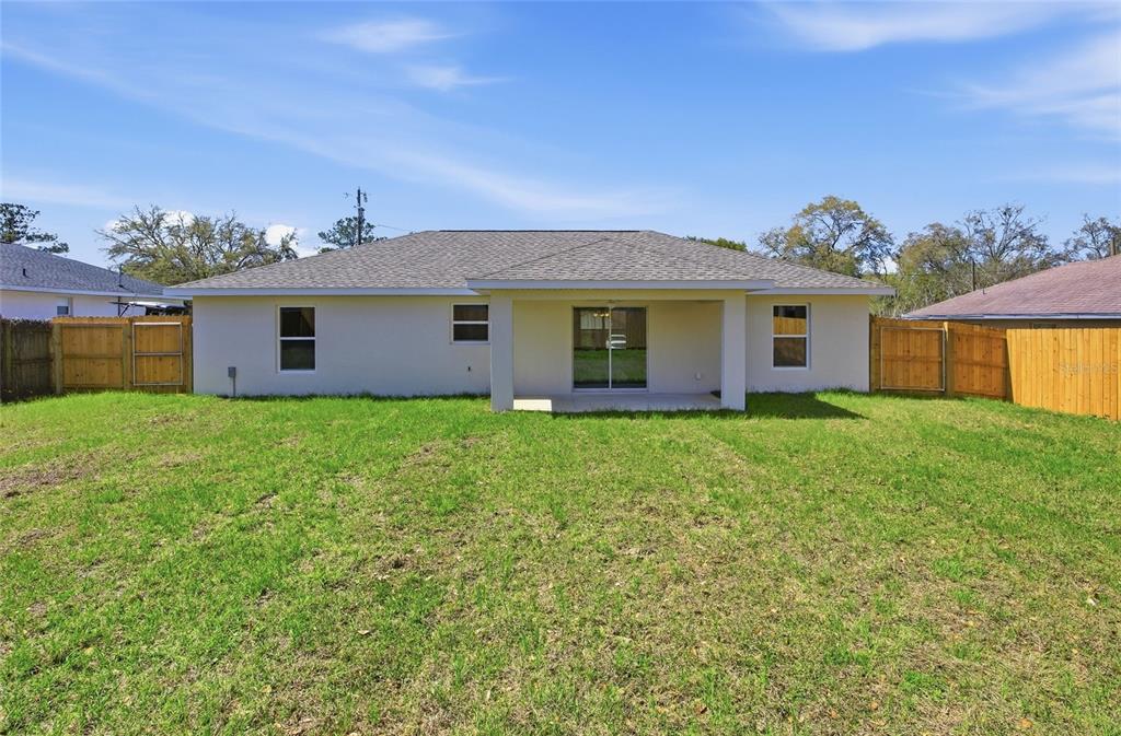 6762 Cherry Road Ocala, FL 34472 - Photo 24 of 29 a front view of house with yard and green space