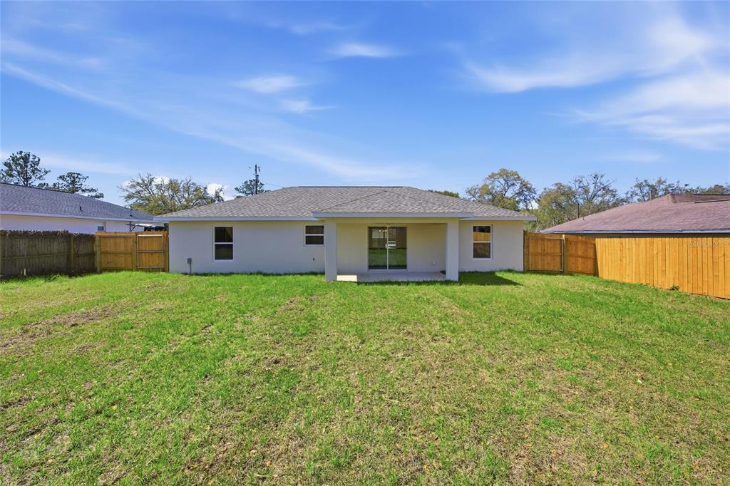 6762 Cherry Road Ocala, FL 34472 - Photo 25 of 29 a view of a yard in front of a house with a large tree
