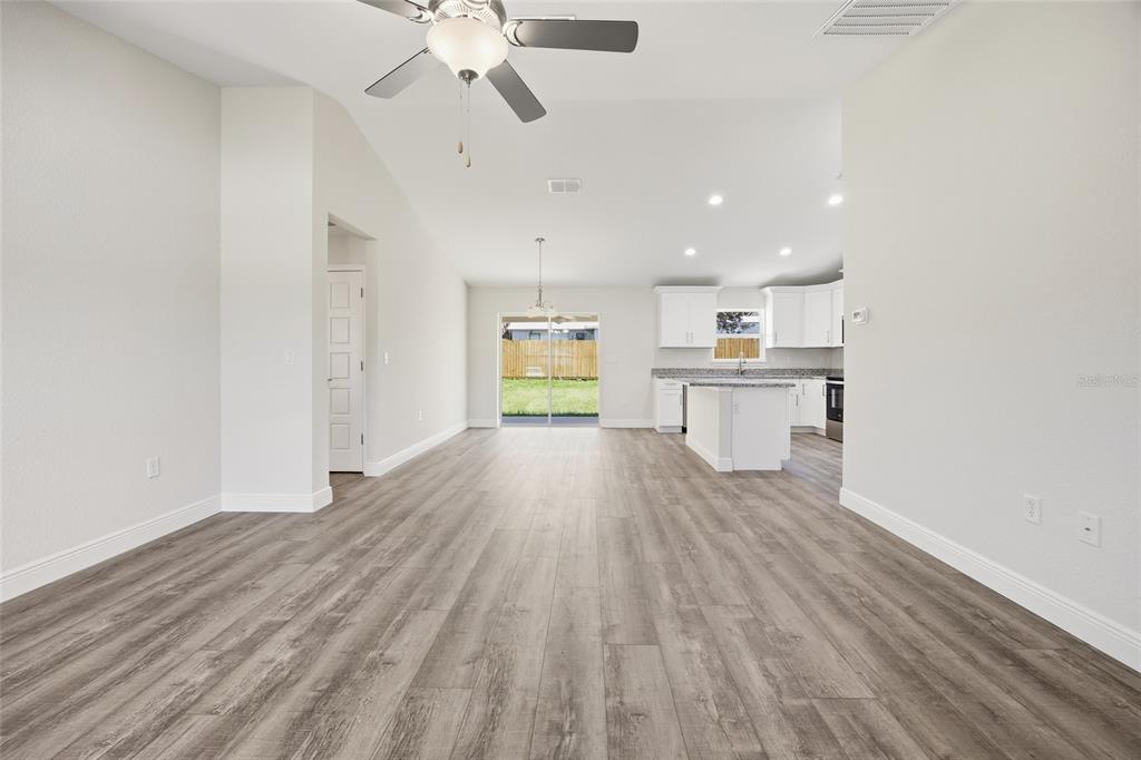 6762 Cherry Road Ocala, FL 34472 - Photo 3 of 29 a view of kitchen with wooden floor electronic appliances and window