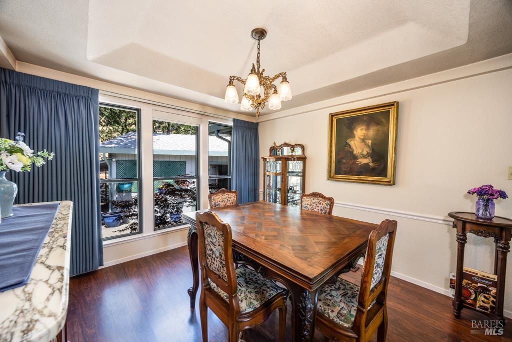 6707 Badger Creek Road Santa Rosa, CA 95409 - Photo 12 of 53 a view of a dining room with furniture window and wooden floor