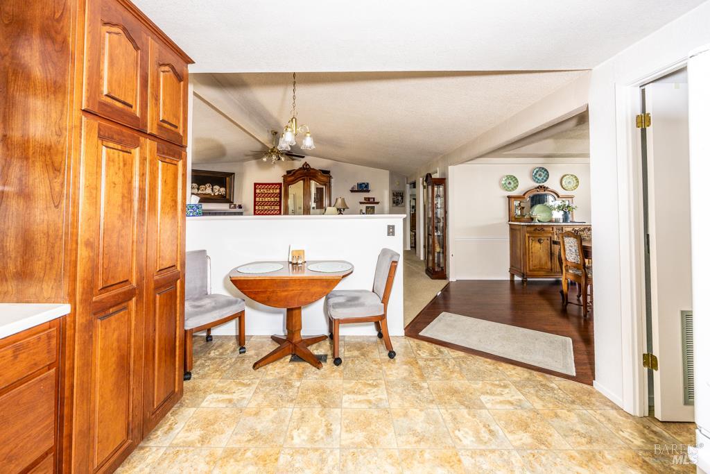 6707 Badger Creek Road Santa Rosa, CA 95409 - Photo 16 of 53 a view of a hallway and a livingroom with furniture