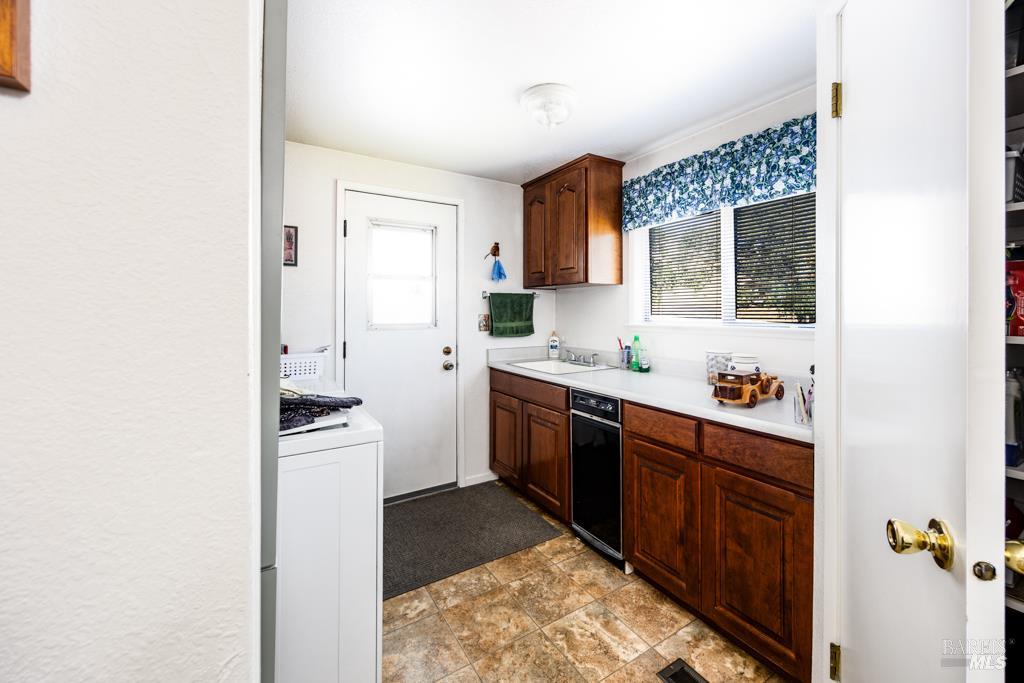 6707 Badger Creek Road Santa Rosa, CA 95409 - Photo 17 of 53 a kitchen with stainless steel appliances granite countertop a sink stove and refrigerator