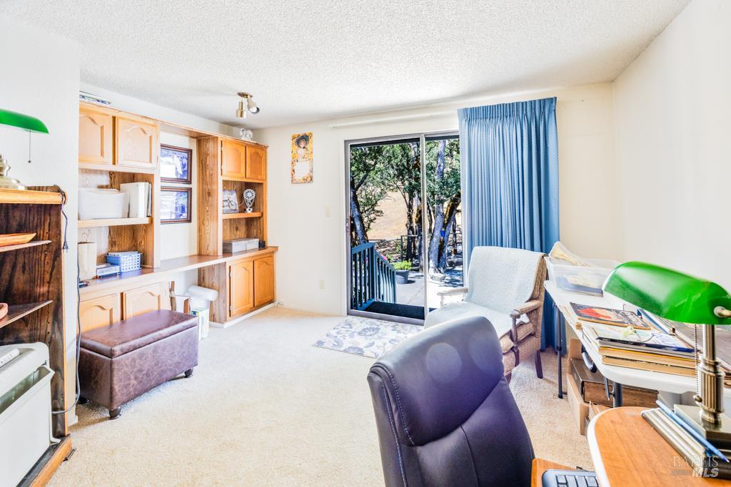 6707 Badger Creek Road Santa Rosa, CA 95409 - Photo 18 of 53 a living room with furniture and a window