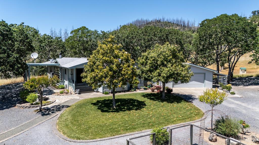 6707 Badger Creek Road Santa Rosa, CA 95409 - Photo 2 of 53 a view of a house with a yard patio and fire pit