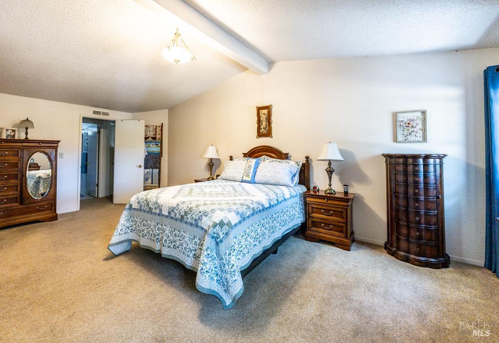 6707 Badger Creek Road Santa Rosa, CA 95409 - Photo 21 of 53 a bedroom with a bed and a couch