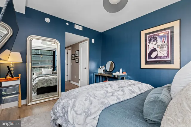 a bedroom with a bed and a view of bathroom