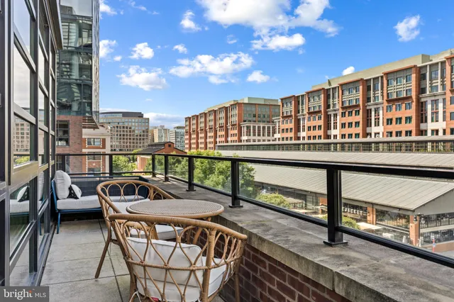 a view of a balcony with chairs
