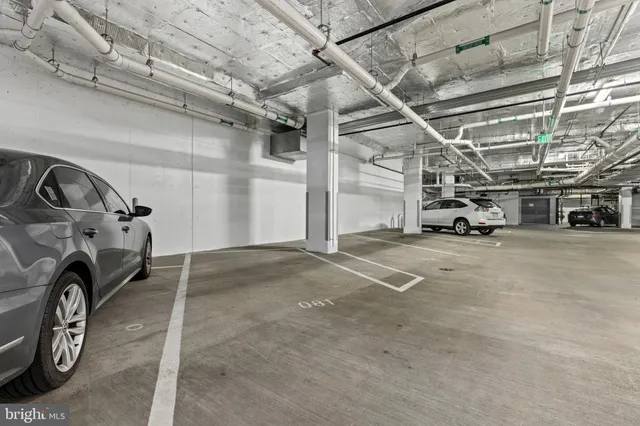 a view of parking garage with cars