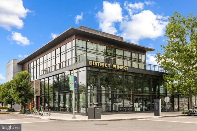 a view of a swimming pool with lawn chairs and a fire pit