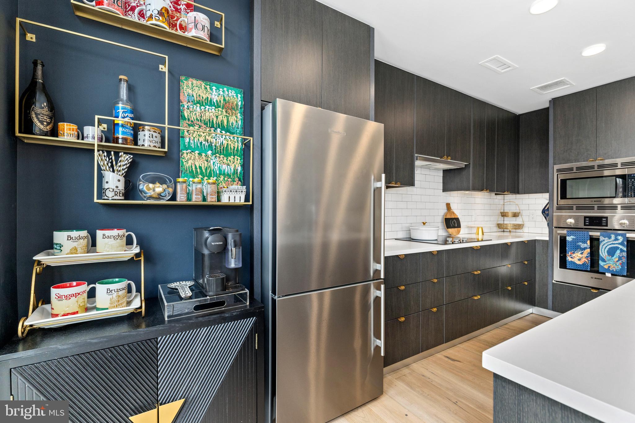 1300 4th Street Southeast, Unit 404 Washington, DC 20003 - Photo 9 of 51 a kitchen with a refrigerator and a stove top oven