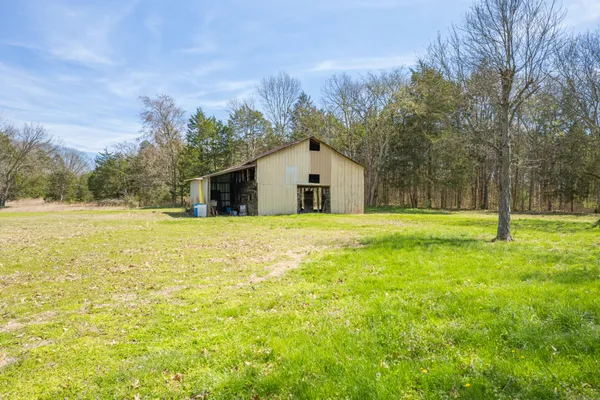 a backyard of a house with lots of green space