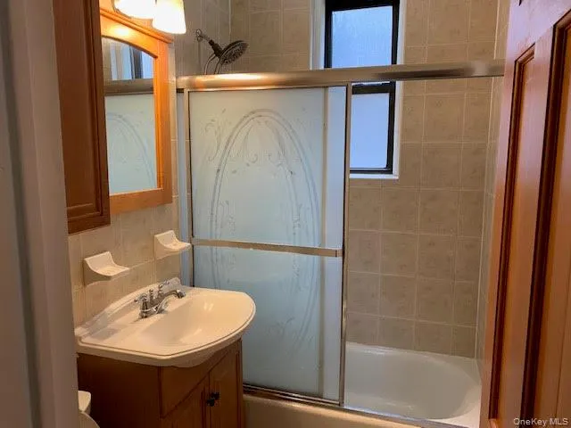 a bathroom with a sink and mirror