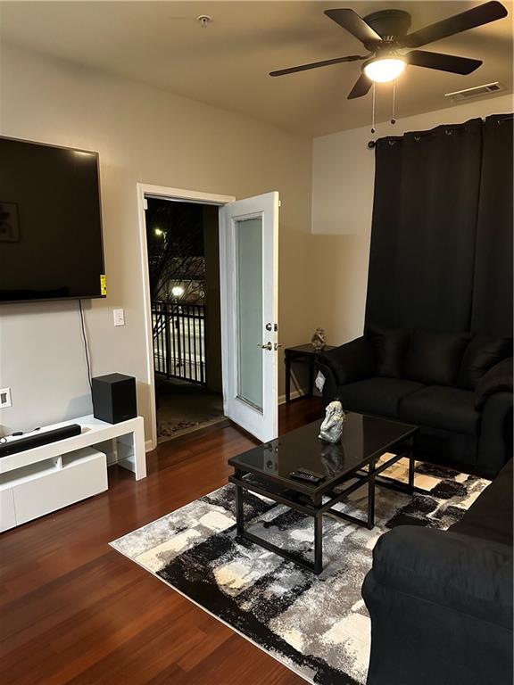 870 Mayson Turner Road Northwest, Unit 1110 Atlanta, GA 30314 - Photo 16 of 18 a living room with furniture and a flat screen tv