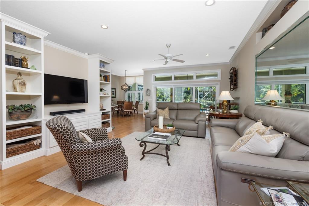 1976 Southwest Oak Ridge Road Palm City, FL 34990 - Photo 11 of 65 a living room with furniture and a flat screen tv