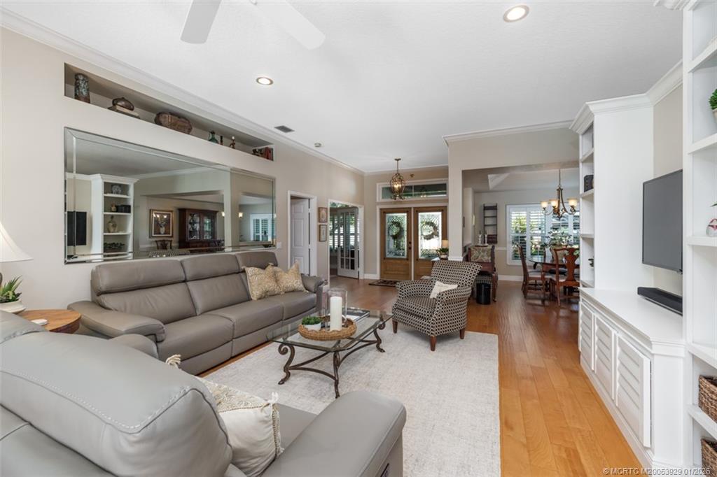1976 Southwest Oak Ridge Road Palm City, FL 34990 - Photo 12 of 65 a living room with furniture and a flat screen tv