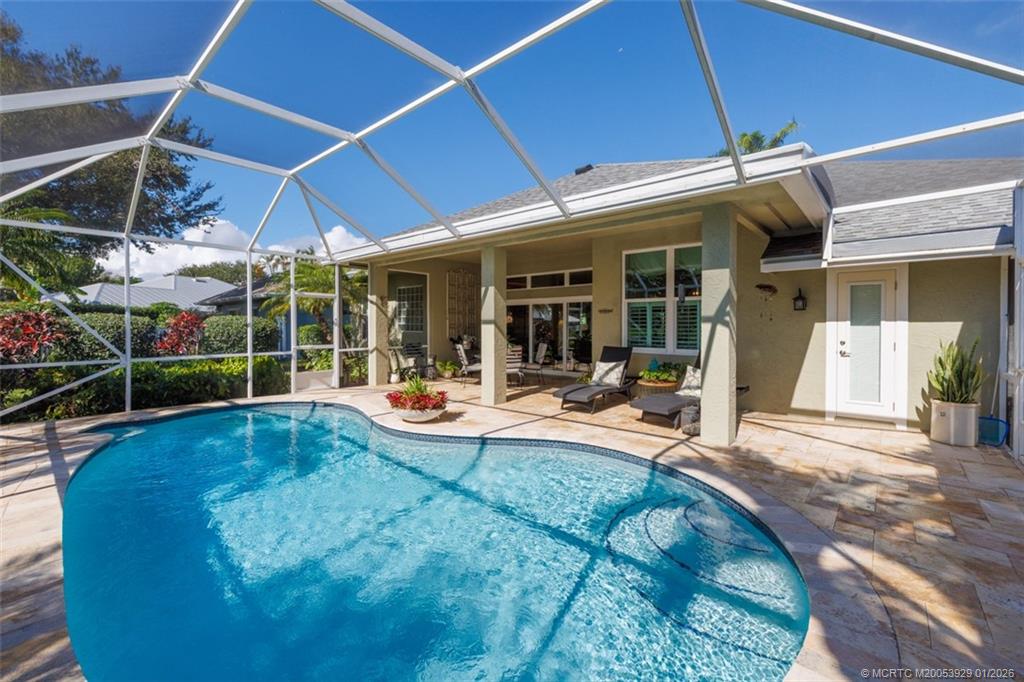 1976 Southwest Oak Ridge Road Palm City, FL 34990 - Photo 34 of 65 a view of a house with sitting area and porch