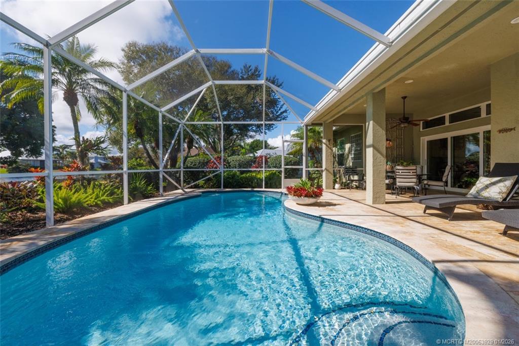 1976 Southwest Oak Ridge Road Palm City, FL 34990 - Photo 35 of 65 a view of a swimming pool with a patio and a yard