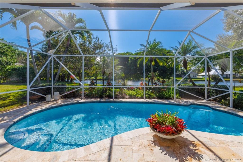 1976 Southwest Oak Ridge Road Palm City, FL 34990 - Photo 37 of 65 a view of a swimming pool with a patio