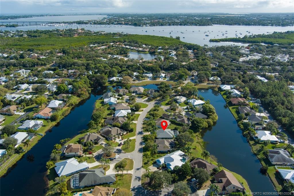1976 Southwest Oak Ridge Road Palm City, FL 34990 - Photo 49 of 65 an aerial view of lake and residential houses with outdoor space