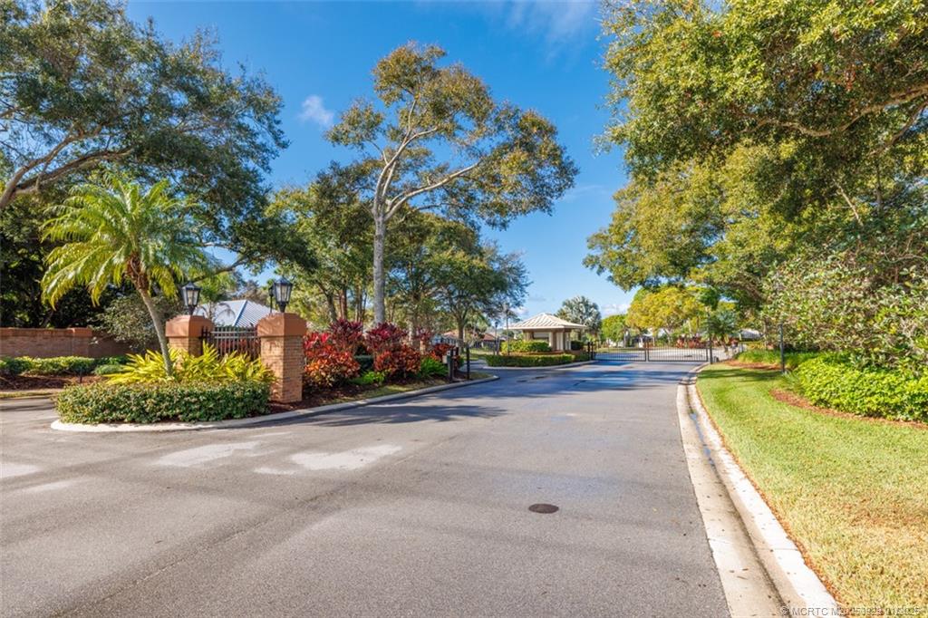 1976 Southwest Oak Ridge Road Palm City, FL 34990 - Photo 51 of 65 a view of a swimming pool with a yard